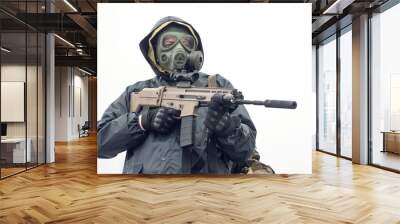 Soldier in gas mask and raincoat with a rifle concept. Wall mural