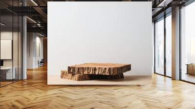 Stacked tree bark podium on wooden surface Wall mural