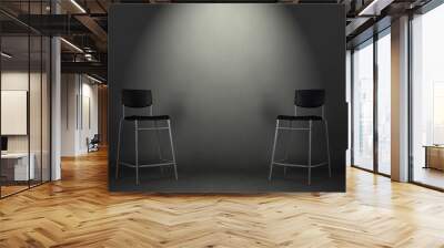 Two black chairs isolated on gray background in the studio with copy space. Job interview room. Wall mural