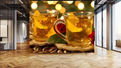 Two cups of tea with a rose on a table Wall mural