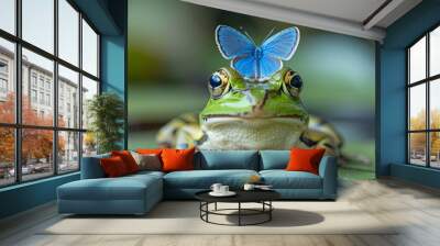 A green frog sits calmly on a lily pad while a delicate blue butterfly gently perches on its head, creating a serene moment in nature Wall mural