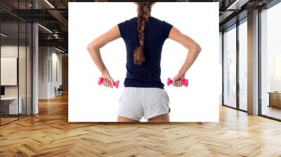 Woman holding two pink dumbbells Wall mural