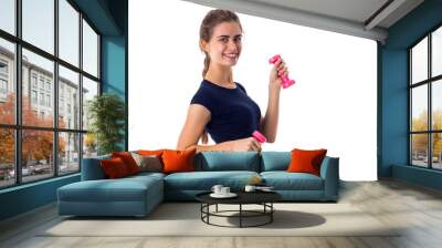 Woman holding two pink dumbbells Wall mural