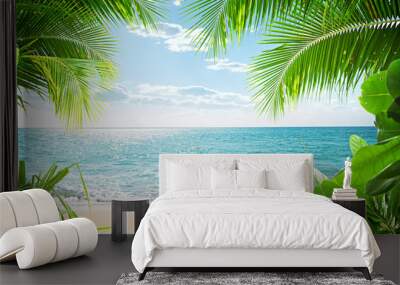 View of nice tropical beach with some palms Wall mural