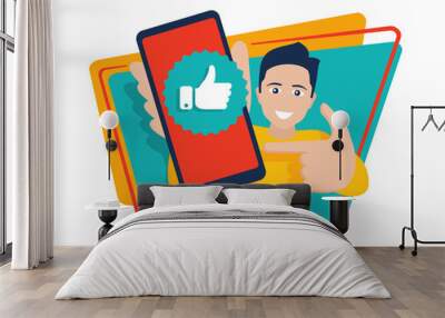 Happy young smiling man holding phone with thumbs up (like) mark on a screen - vector illustration in flat cartoon style Wall mural