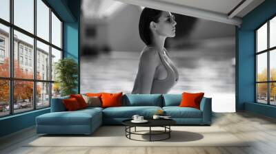 beautiful tanned woman in blue swimwear relaxing in swimming pool spa near expensive villa on hot summer day Wall mural