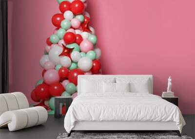 Christmas tree made of many pastel color balloons and pastel color pink gifts present boxes Wall mural