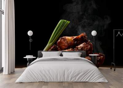 Hot and spicy bbq chicken wings with dip and hot sauce on wooden plate with steam smoke  Wall mural