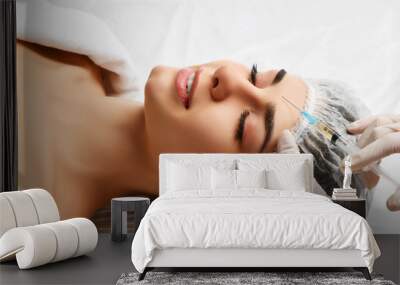 Plastic surgery beauty concept young brunette woman face and  doctor hand in glove with syringe Wall mural