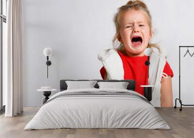 Portrait of crying, yelling, abused kid girl after family conflict. Family conflict, violence Wall mural