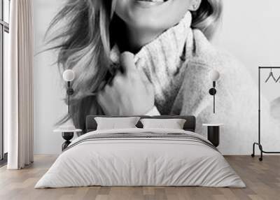 Portrait of young sexy smiling blonde woman model in cosy warm sweater Wall mural