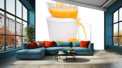 preparing fresh orange juice squeezed with electric juicer Wall mural