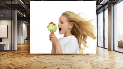 Pretty baby girl kid holding ice cream in waffles cone with stra Wall mural