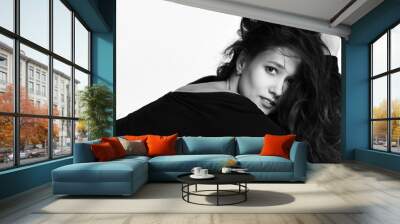 Sensual curly hair beautiful girl smiling surprised in stylish black fashion dress. Black and white image  Wall mural