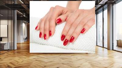 Woman hands with manicured red nails Wall mural