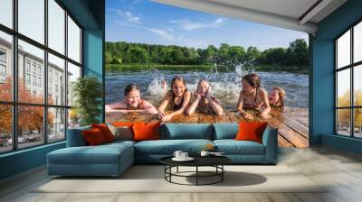 Happy children enjoying summer holidays at a lake Wall mural