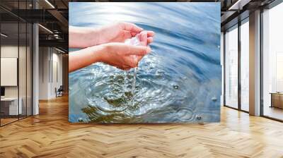 Holding water in cupped hands Wall mural