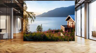 Wooden house with terrace overlooking scenic lake at sunset in Norway Scandinavia Wall mural