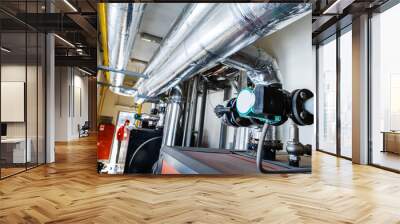 Pump and pipes in an industrial boiler room. A small room for heating equipment in an apartment building. Selective focus Wall mural