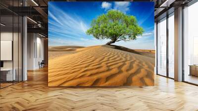 Lonely green tree in desert dunes Wall mural