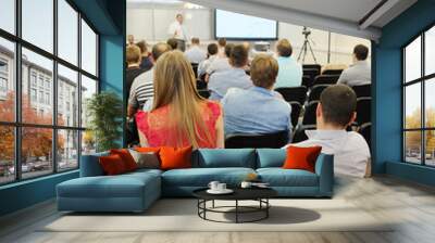 the audience listens to the acting in a conference hall Wall mural