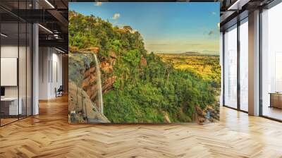 Beautiful waterfall flowing from the cliff in the tropical jungles panoramic top view Wall mural