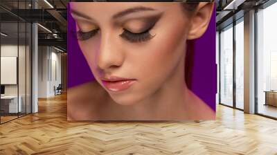 beautiful woman with evening make up on purple Wall mural