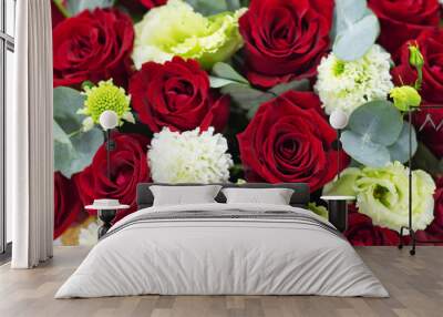 red roses on a white background composition of red roses in a basket Wall mural