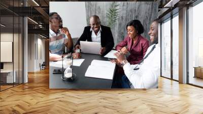 Morning conference of company employees who discuss work issues before the start of the day in the conference room Wall mural