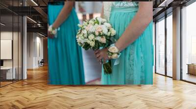 A close up view of a bride's hands and bouquet with the bridal p Wall mural