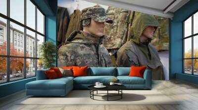 Mannequins in a camouflage military uniform in a store Wall mural