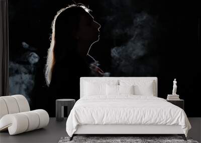 silhouette of a girl in the dark. smoke . steam . girl in a dark room. Wall mural