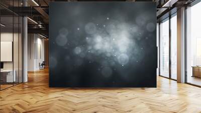 A cluster of light spots in white and gray tones on a dark blurred background Wall mural