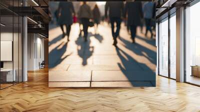 Silhouettes and shadows of people on the sidewalk in the morning city hustle, blurred image Wall mural