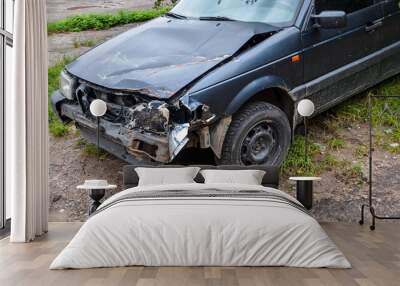 A close-up shot of a crashed headlight and front corner of a old car. Effects of drunk driving - traffic accident. Smashed vehicle. Wall mural