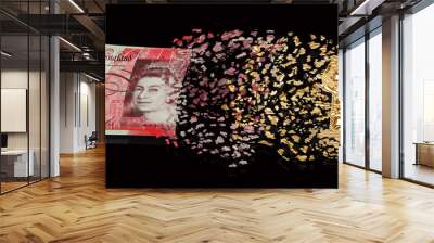 Bitcoin metal coin is converted in Pound Sterling banknote by particles on dark financial background. Header means price or exchange rate of crypto currency on market or investment with risk Wall mural