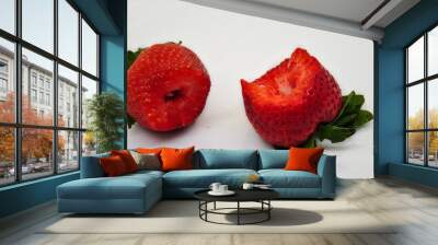 bitten fresh ripe strawberries on a white background Wall mural