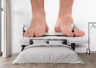 Man standing on weight scale Wall mural