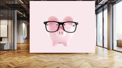 Piggy bank in in glasses  on pastel pink background Wall mural