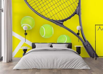 Tennis racket and ball sports on yellow background Wall mural