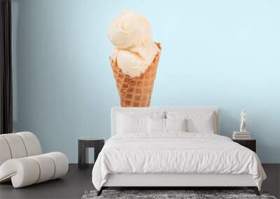 Vanilla ice cream cone on white background. Wall mural