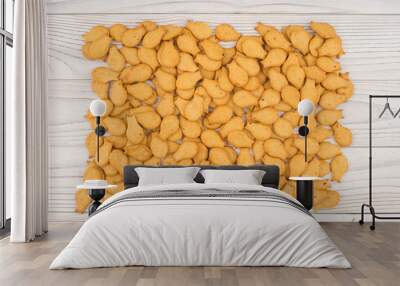 goldfish crackers on an old wooden table. Wall mural