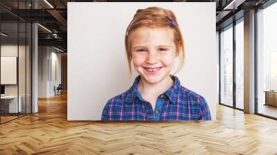 portrait of happy redhead little girl smiling. Wall mural