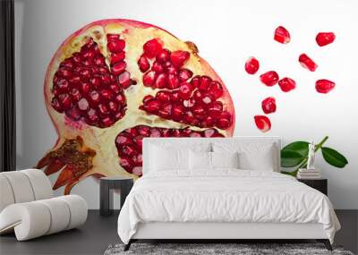 pomegranate fruit with seeds and green leaves isolated on white background top view Wall mural