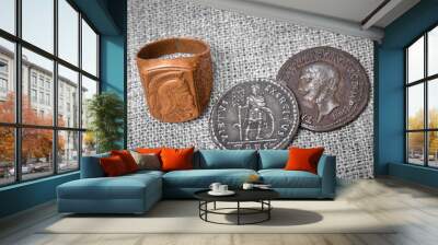 signet ring and two coins of the ancient Roman Empire. Wall mural