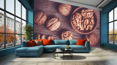 Walnut on rustic old wooden table Wall mural