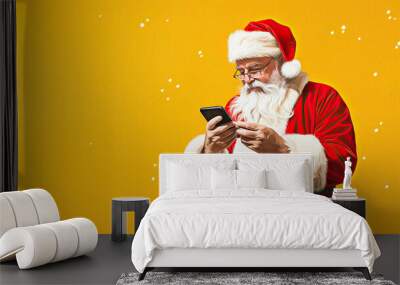 santa claus with smartphone on yellow background, christmas and new year banner template Wall mural