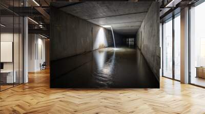 Waterfall in underground sewer square tunnel. Wall mural