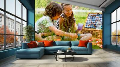 Kids having fun while picnicking Wall mural