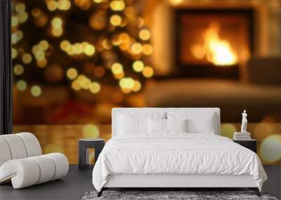 Blurred living room with Christmas tree and fireplace, New Year background with blur effect and warm golden tones, Photo with free space for text, with bokeh effect Wall mural